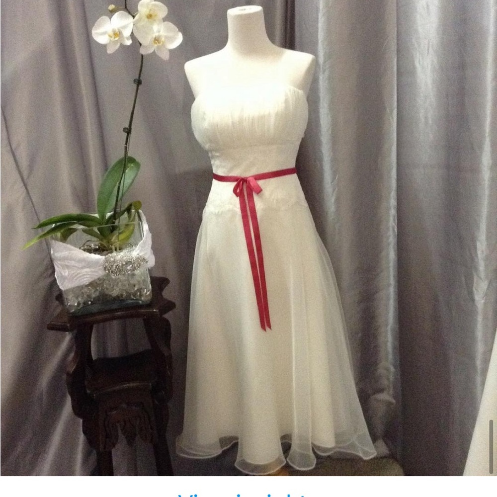 Elegant White Skirt with Red Ribbon